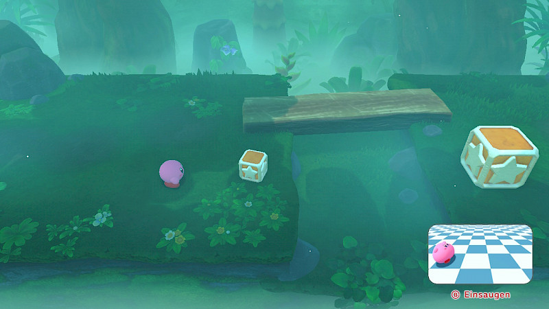 Kirby steht vor einer Kiste. Unten Rechts ist ein Video eingeblendet in dem Kirby eine Kiste einsaugt. Darunter steht B: Einsaugen.